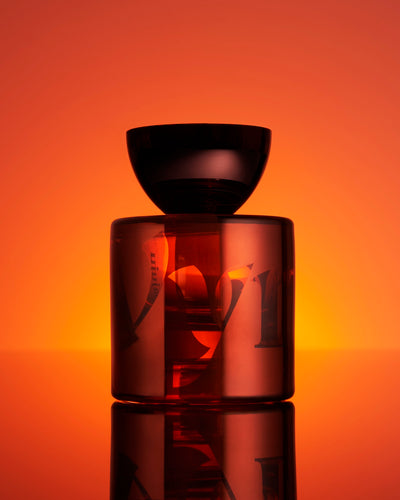 Close-up of the Mamajuju Eau de Parfum bottle by Vyrao, featuring a sleek design with earthy tones, reflecting the fragrance's grounding and natural essence.