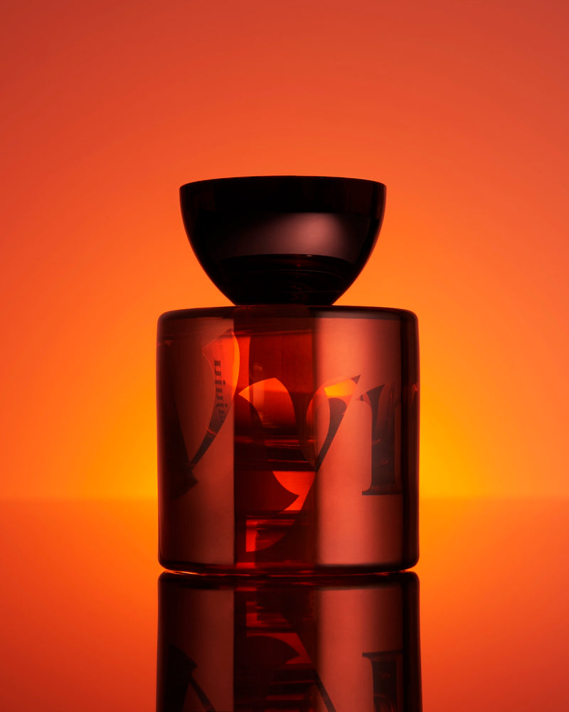 Close-up of the Mamajuju Eau de Parfum bottle by Vyrao, featuring a sleek design with earthy tones, reflecting the fragrance&